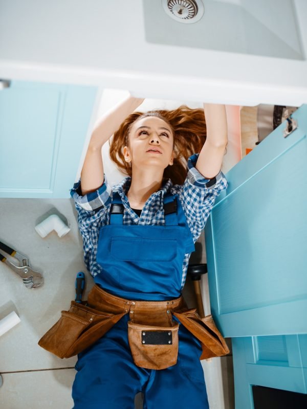 female-plumber-lying-on-the-floor-top-view.jpg
